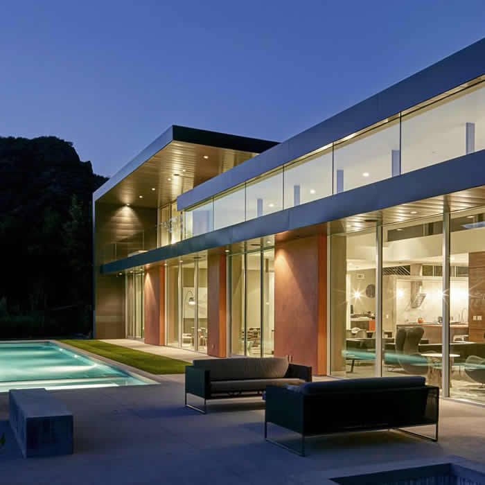 Outside view of a modern house with a pool
