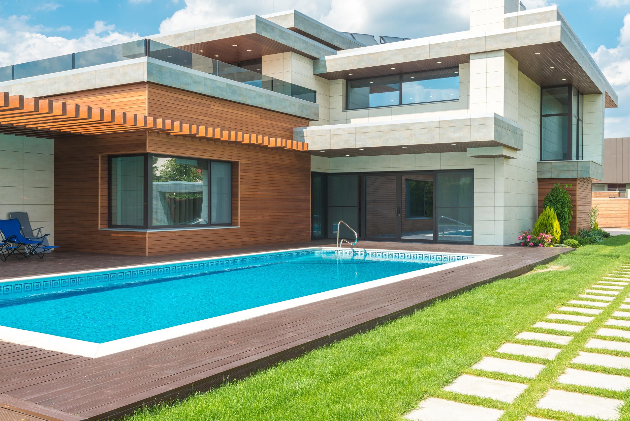 Outside view of a modern house with a pool